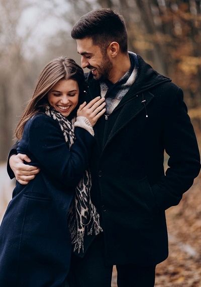 Young couple together walking in an autumn park